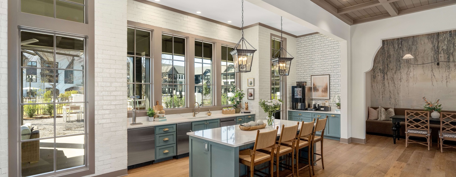 a spacious resident kitchen and lounge area with natural light