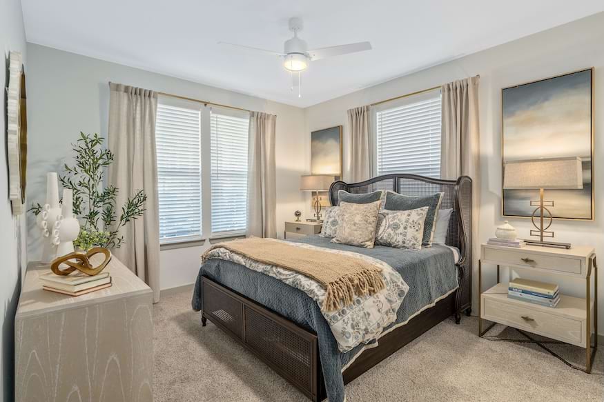 Plush beige broadloom carpet (Mohawk Revive, Havana) in a Portier Midtown bedroom